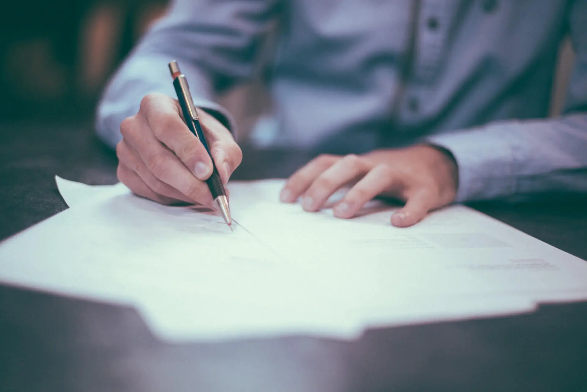 Estate planning attorney signing documents