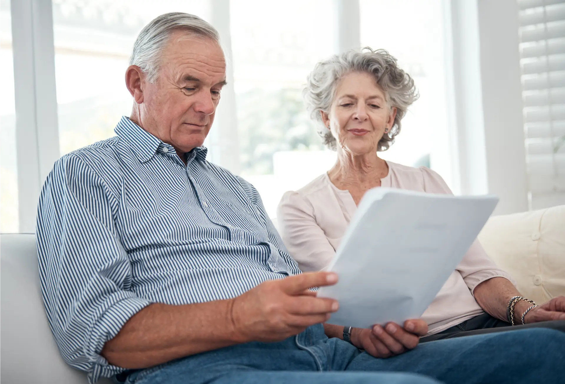 Elderly couple reviews medicaid documentation